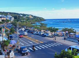 上圓旅店 到沙灘,7-11只要3分鐘, hotel com estacionamento em Nanwan