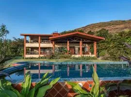 SaffronStays Althea - 4BR veg-only luxury villa with pool, jacuzzis, gourmet meals and Lohagad-Pawna lake views