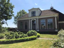 Statige boerderijwoning met vrij uitzicht en tuin, vakantiehuis in Hoogzand