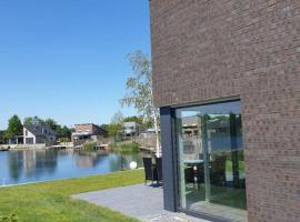 Ferienhaus mit privatem Seezugang, Sauna, Strand, Wassersport, Ruderboot, Stand Upp, hotel Barßelben