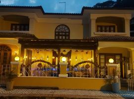 Casa Amarela Pousada, отель в городе Домингус-Мартинс
