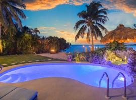Oceanfront villa with private beach, heated pool, tiki and boat dock, pet-friendly hotel in Key West