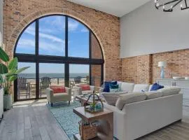 Split Level Pentouse with Floor to Ceiling Arched Window and Panoramic View of the Coast