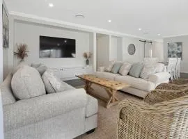 4 bedroom home with theatre room, close to CBD and beaches.