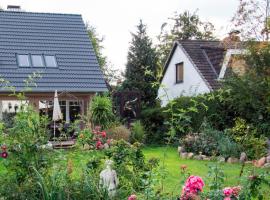 Dachgeschosswohnung Scharbeutz mit Garten, viešbutis mieste Šarboicas