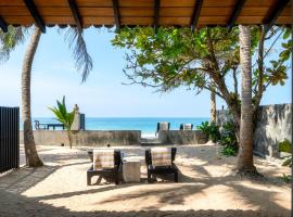 Red Parrot Beach Villa, cabaña o casa de campo en Ambalangoda