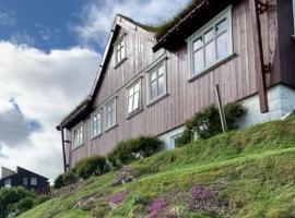 Cosy groundfloor apartment, vacation rental in Sørvágur