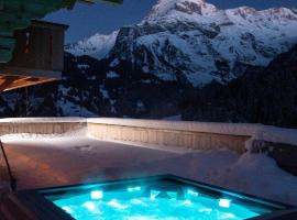 Chalet mit Kino und Jacuzzi in Gsteig b. Gstaad, hotel v destinácii Gsteig