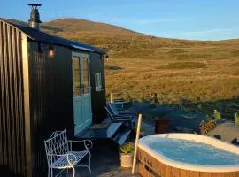 Black hut at Slieve Croob Glamping