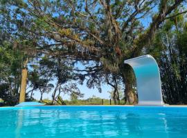 Sítio com piscina Hidromassagem com acesso ao Rio Mampituba, villa en Passo de Torres