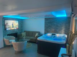 Sandspa logement avec jacuzzi, rumah kotej di Orange