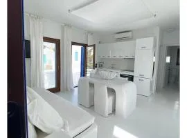 White luxury suite with shared pool downtown by Mykonos Eight
