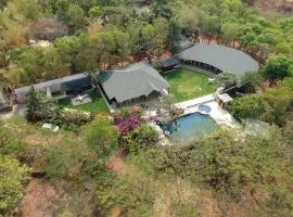 StayVista's Lush Villa - Rustic-Meets-Modern Interiors, Pool, Jacuzzi & Indoor activities