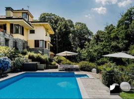 Villa Olivia con piscina e sauna a pochi minuti da Arona, hotel a Dagnente