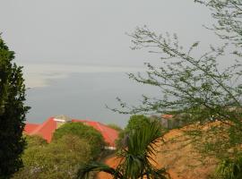 Hilltop Lodge, hotel en Guwahati