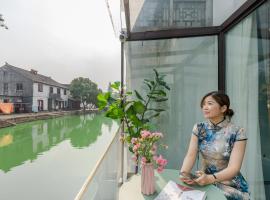 Tongli Slowlife River View Inn, розміщення в сім’ї у місті Сучжоу