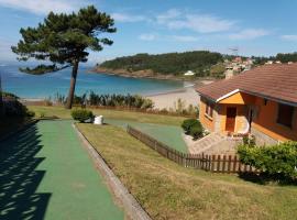 Chalet sobre playa canelas, EN SANXENXO, chalet de montaña en Sanxenxo