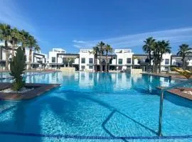 Sunny Ground floor bungalow opposite the swimming pool