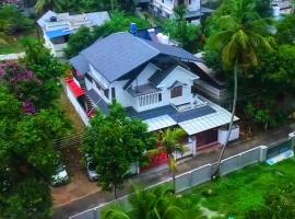 Woodenly Heaven, hotel cu parcare din North Paravur