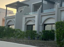 Cozy new townhouse for 6 people!, cabaña o casa de campo en Salalah