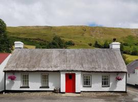 Eddie's Thatched Roadside Cottage, cabaña o casa de campo en Whitefield
