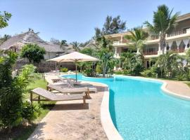Attico con terrazza sulla spiaggia, giardino, piscina, clima, wi-fi، فندق في واتامو