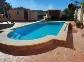 Private villa with heated pool close to the beach.