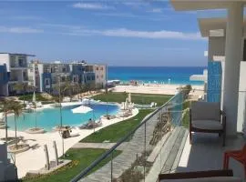 Fouka Bay North Coast 2BRs Modern Style Serviced Apartment with Open Pool & Sea View