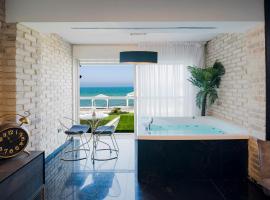שקיעה בים - דירות נופש יוקרתיות עם ג'קוזי ונוף לים, пляжне помешкання для відпустки у Хайфі