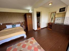 Avocado Apartments, hotel bajet di Khadkagaon