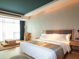 JI HOTEL โรงแรมใกล้สนามบินนานาชาติวัดไต - VTEในBan Houadông