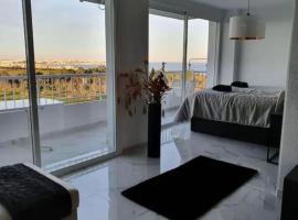 Modern penthouse with sea view, hotel with parking in Punta Prima