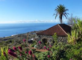 Casita en el campo con vista al oceano