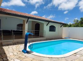 Casa agradável com piscina, ar condicionado e churrasqueira โรงแรมในนาตาล