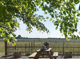 B&B droom in de polder -DE SALON- luxe appartement met prive-sauna – hotel w mieście Arnemuiden