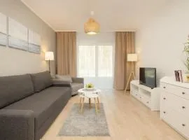Plażowa Park Apartment with Garden by Noclegi Renters
