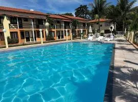 Casas com 2 suítes (ambas com ar split) e internet privativa 300MBPS, no Residencial Village do Bosque, condomínio com quiosques com churrasqueiras , piscina, sauna portaria 24hrs, a aproximadamente 200m da praia de Taperapuã Axé Moi