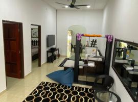 Simple1 Guesthouse, hostal o pensió a Pantai Cenang