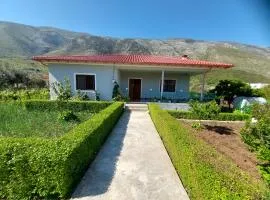 Flowery House near the Sea and the Mountain