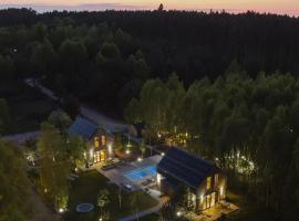 Między Brzozami / Domy w lesie, hotel with parking in Ciekocino