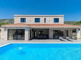 Stylish Villa Neven with 44sqm heated private pool, 4 en-suite bedrooms, 2 living and dining areas, wine cellar