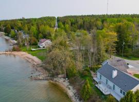 Lakefront De Tour Village Home with Deck and Fire Pit!, hotel with parking in Drummond