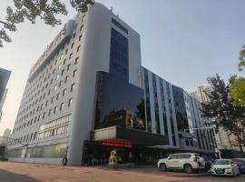Qinhuangdao Yang Cheng Hotel, paplūdimio vie&scaron;butis mieste Cinhuangdao