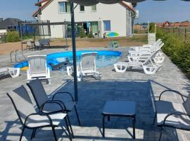 Mazurskie Wzgórze BIS z basenem.3i4, beach rental in Rydzewo