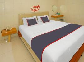 Super OYO Capital O 92676 Hotel Sion Holiday, готель з парковкою у місті South Tangerang