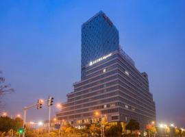 Magnotel Business Hotel Zhenjiang South Station Greenland Square, 3-star hotel in Dantu