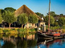 Loft in romantische stolpboerderij bij duingebied.