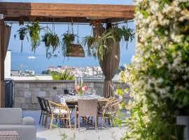Boutique gastrovilla LeTini Luxury with a swimming pool and a terrace with sea view