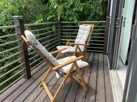 One bedroom with modern kitchen, balcony with water view