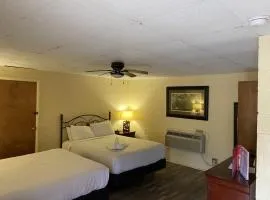 JI9, a Queen Guest Room at the Joplin Inn at entrance to the resort Hotel Room